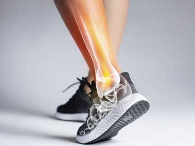 mans leg with in trainers showing inside pain